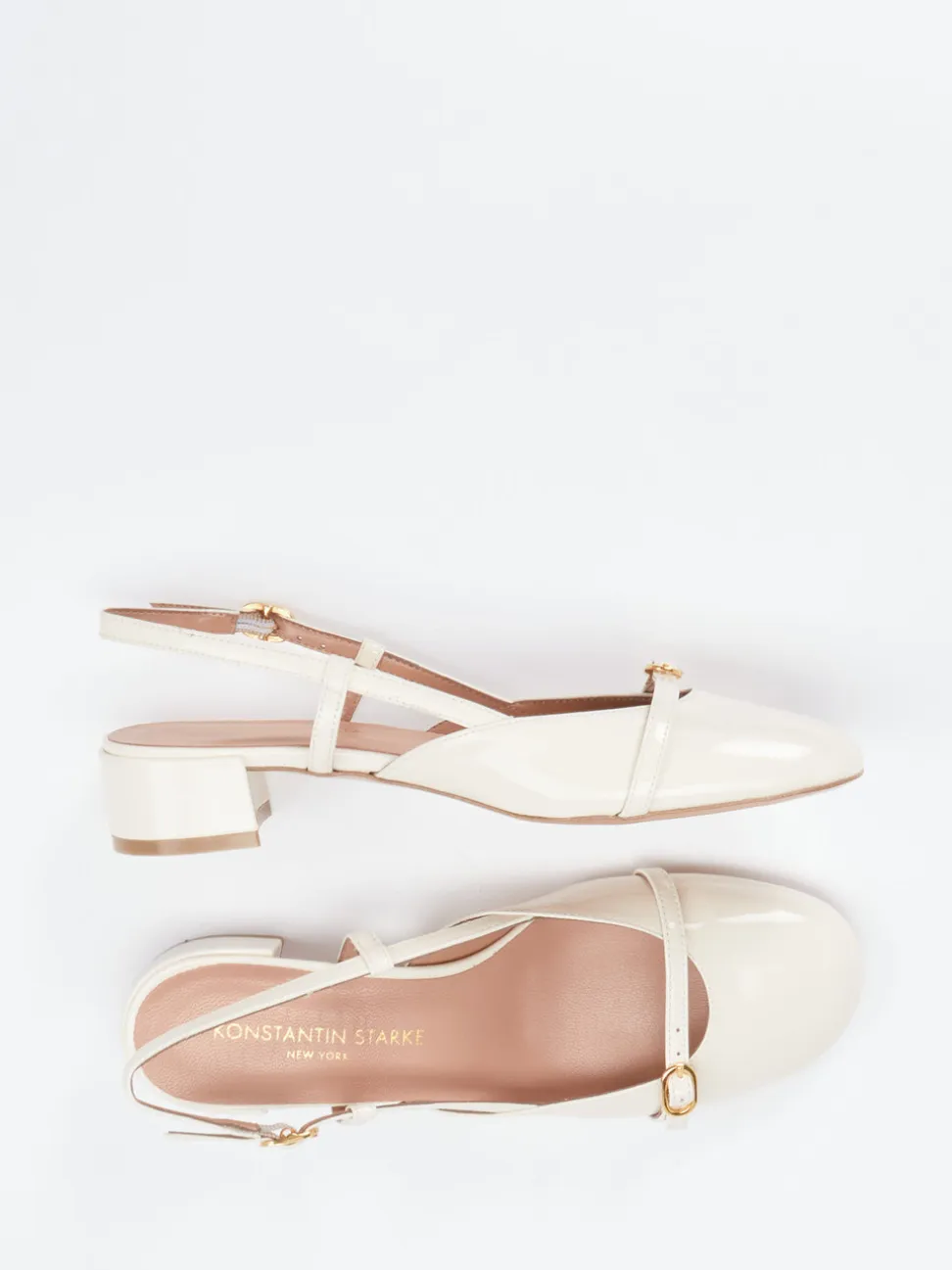 Konstantin Starke – Slingback-Pumps aus Lackleder cremeweiß