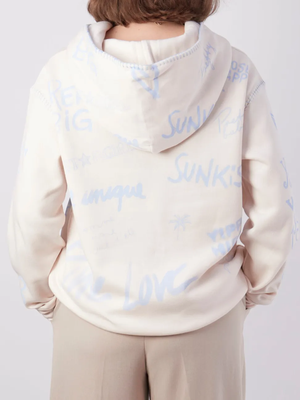 Yippie Hippie – Kapuzenpullover aus Textil in Beige
